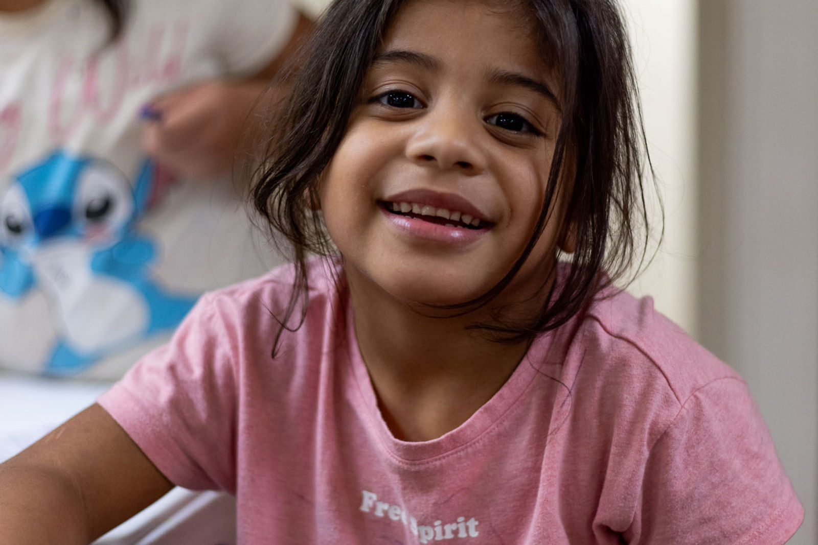 A parent and child together at an AIM family gathering