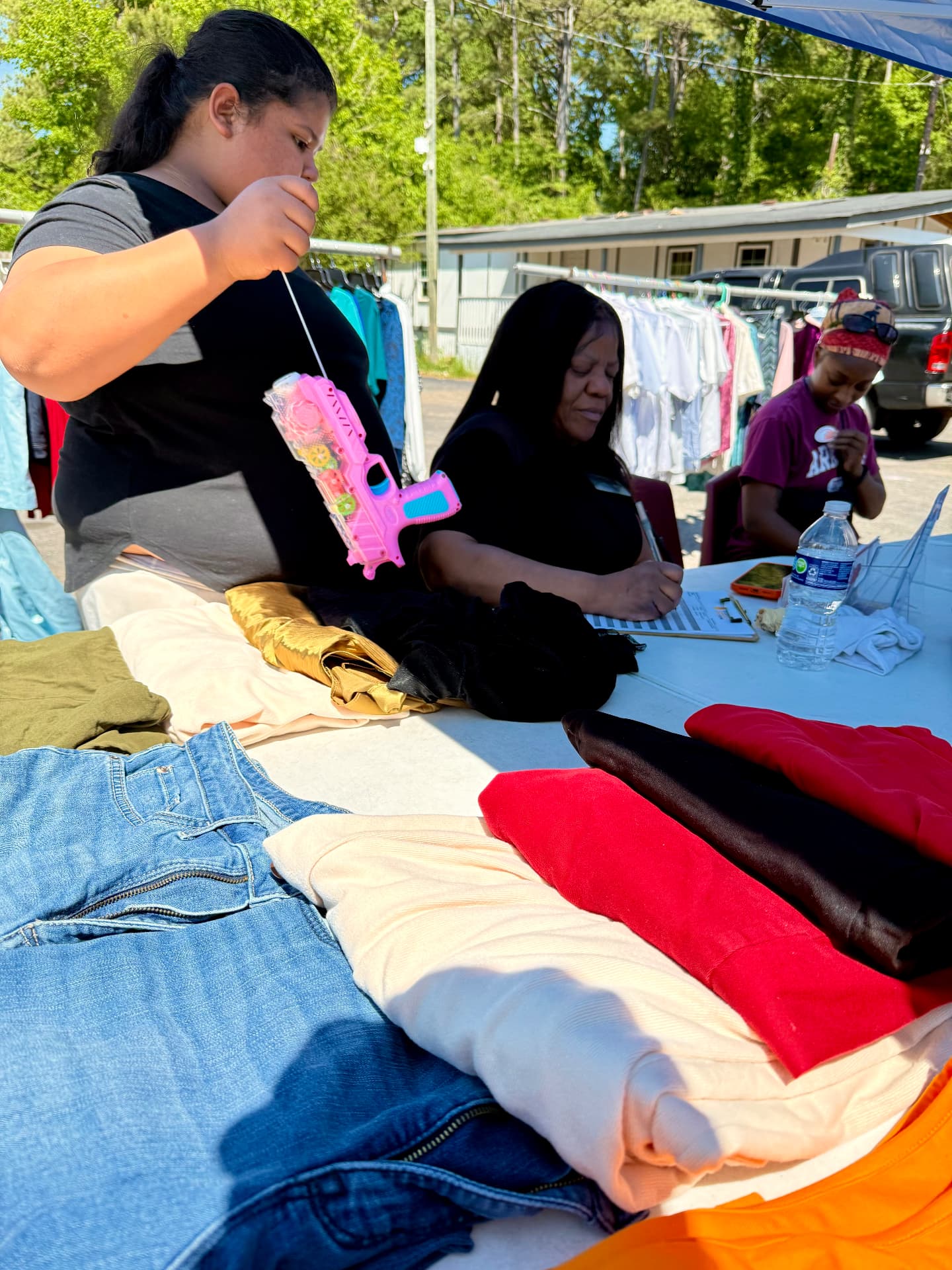 Volunteers sorting donated clothing at an AIM distribution