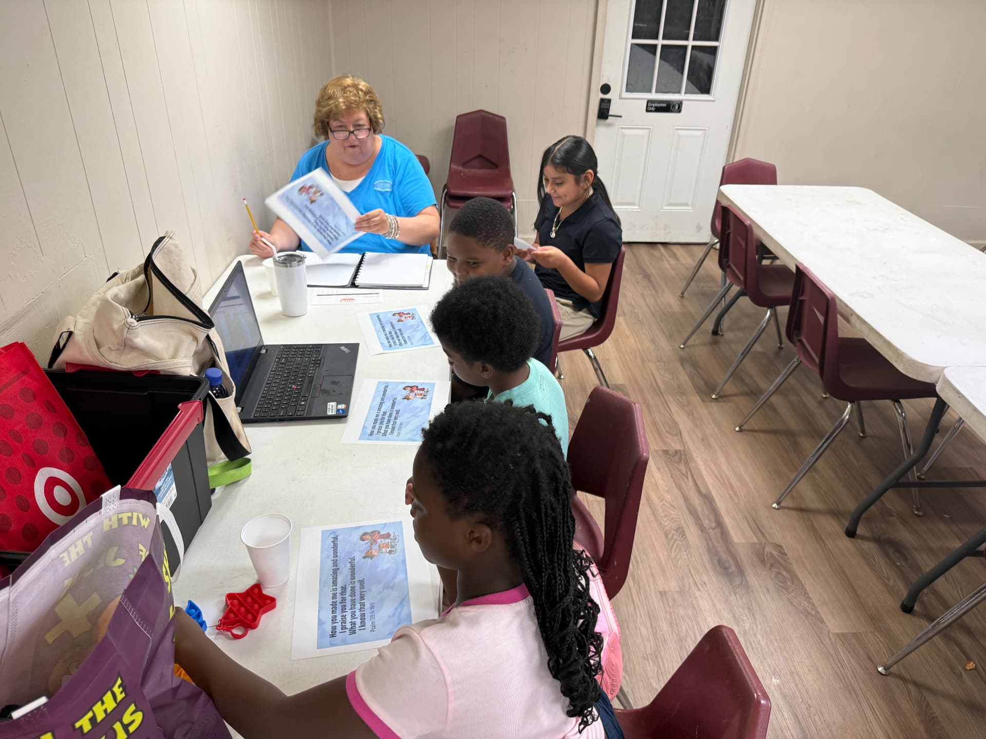 A ThriveKids small group working through a lesson with their leader