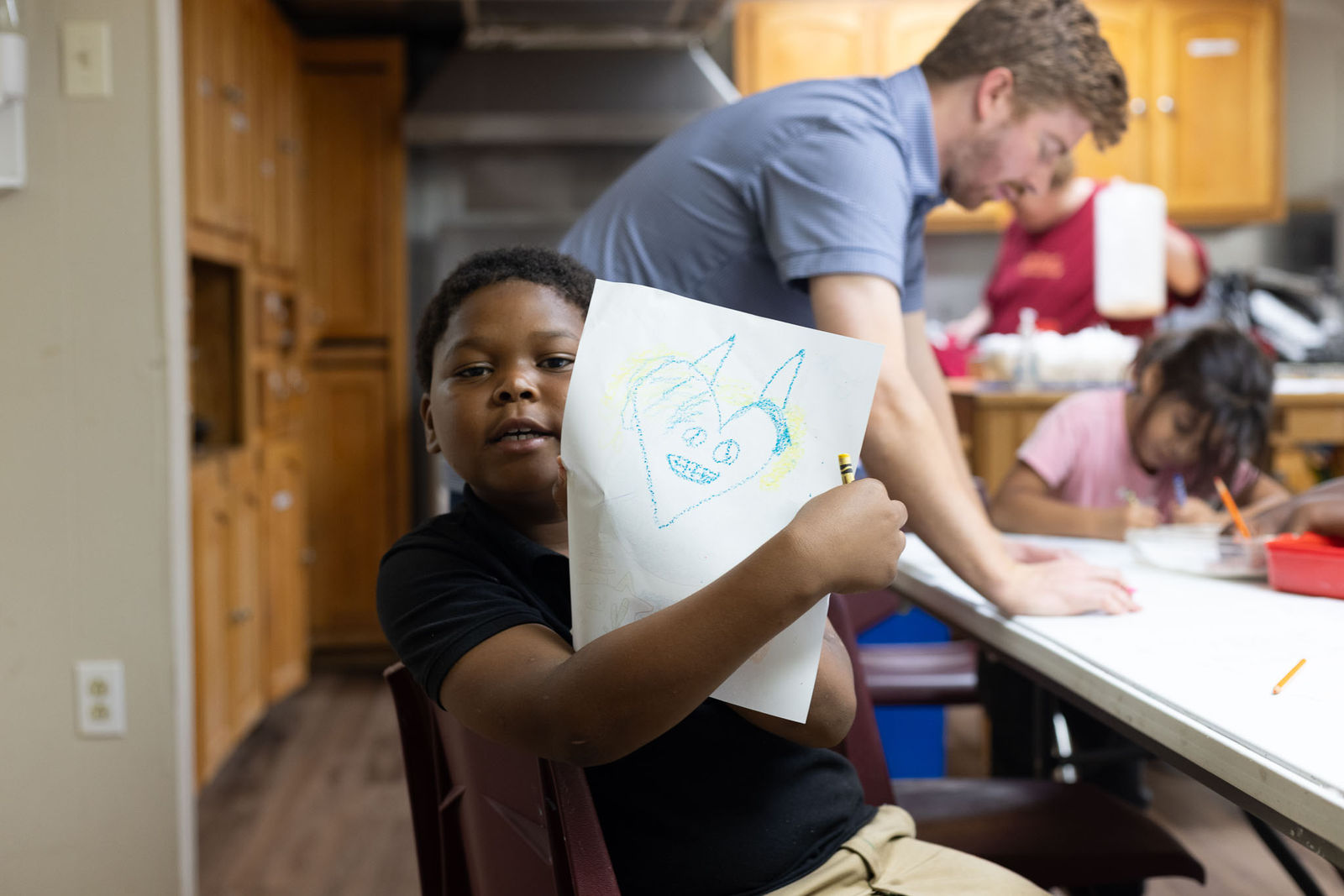 Children working on crafts and activities at a ThriveKids gathering
