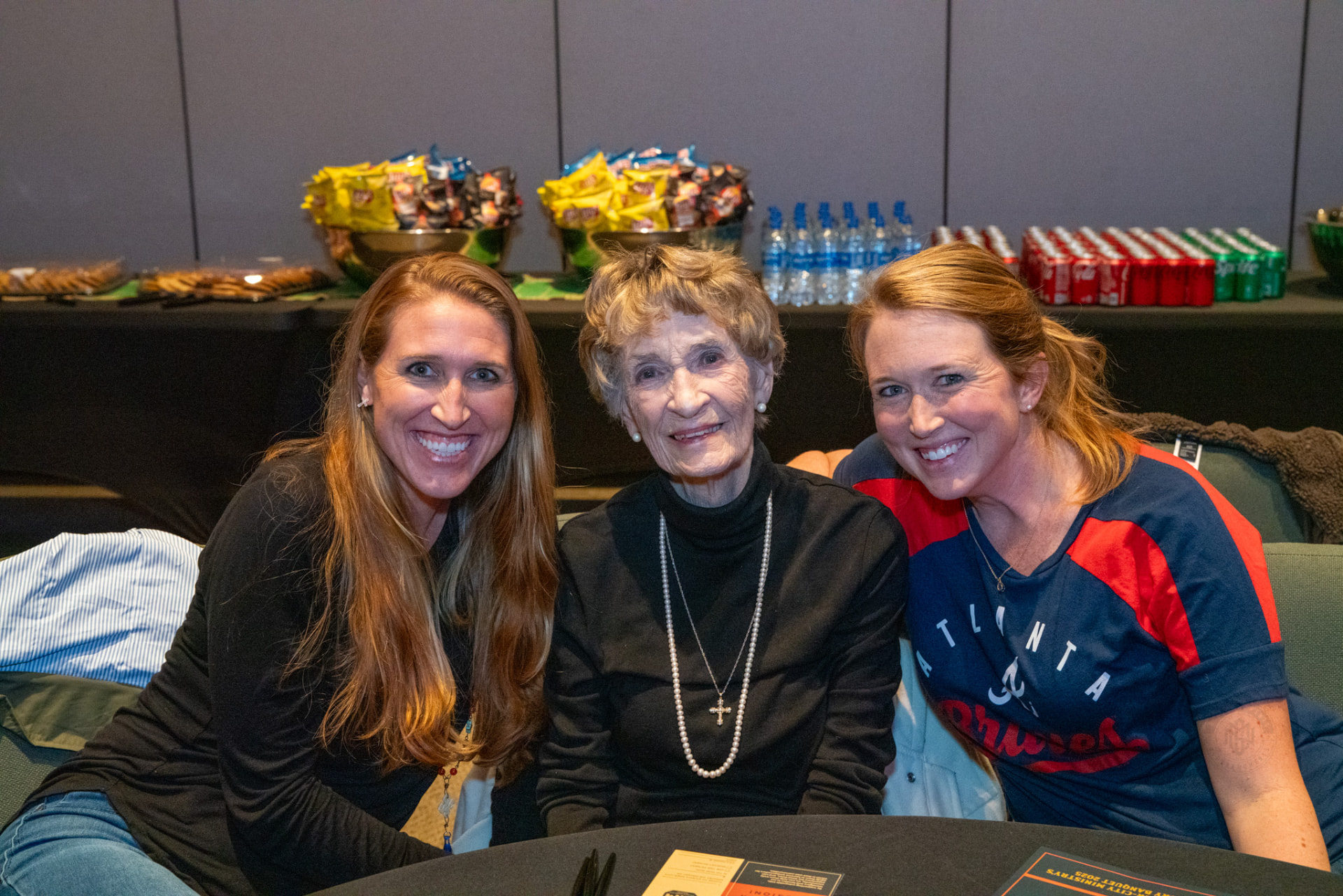 Guests smiling together at a table at a past AIM Victory Banquet