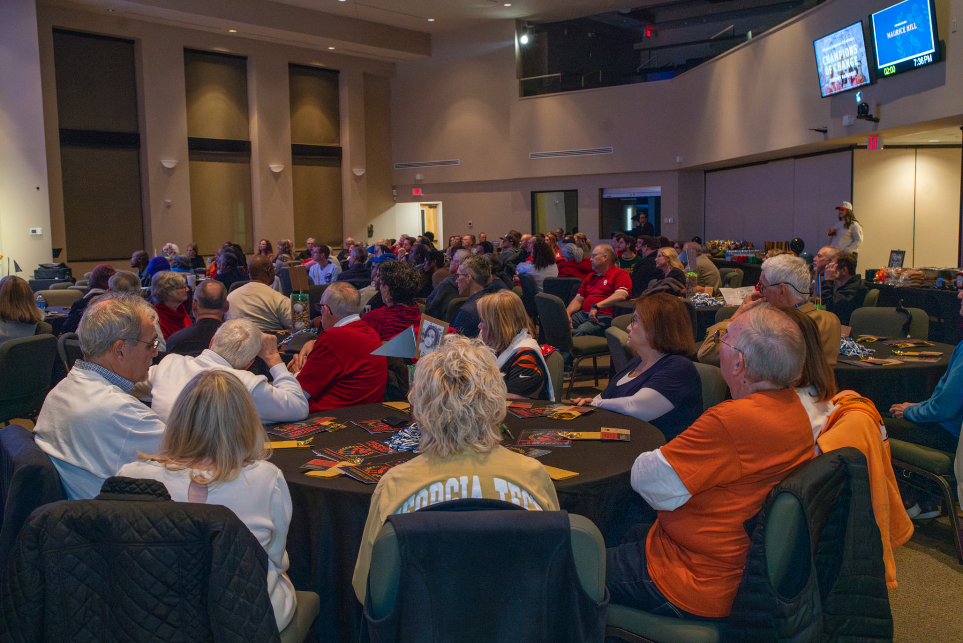 Guests watching a presentation at a past AIM Victory Banquet